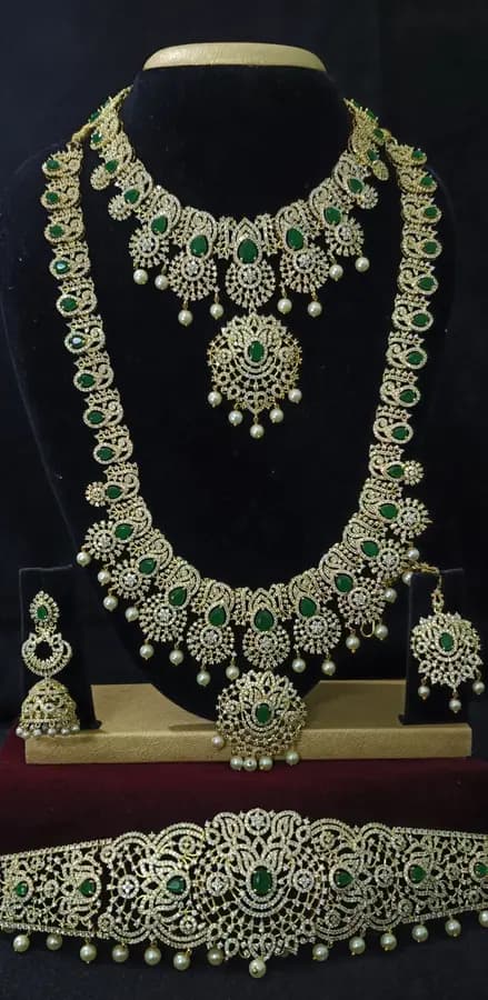 American diamond bridal jewellery set — white stone choker, haram and jhumka on a display stand
