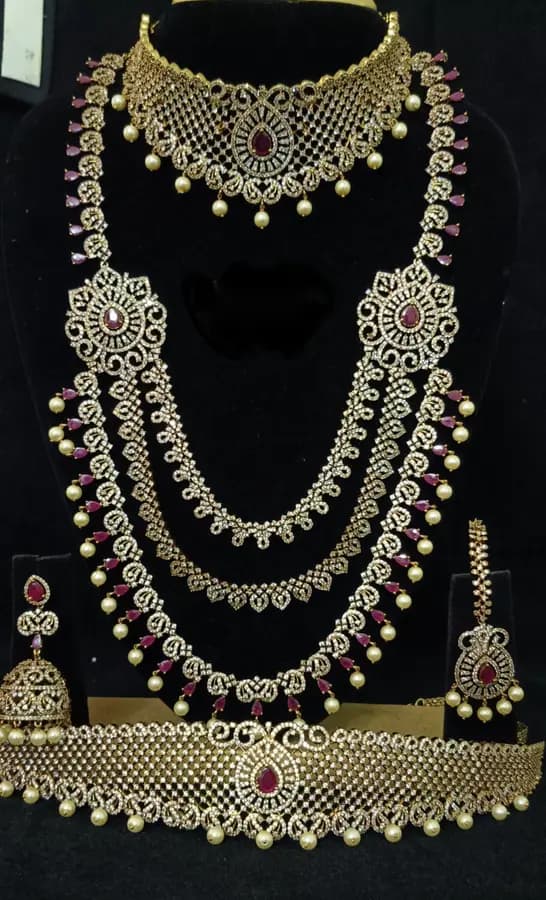 American diamond bridal jewellery set — white stone choker, haram and jhumka on a display stand