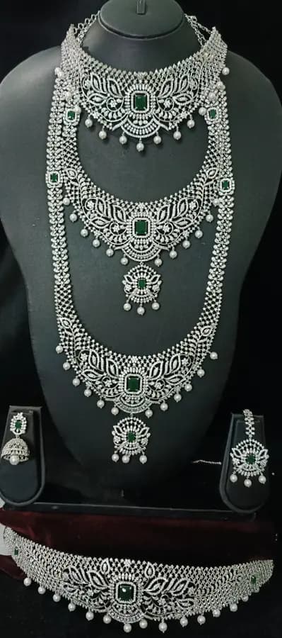 American diamond bridal jewellery set — white stone choker, haram and jhumka on a display stand