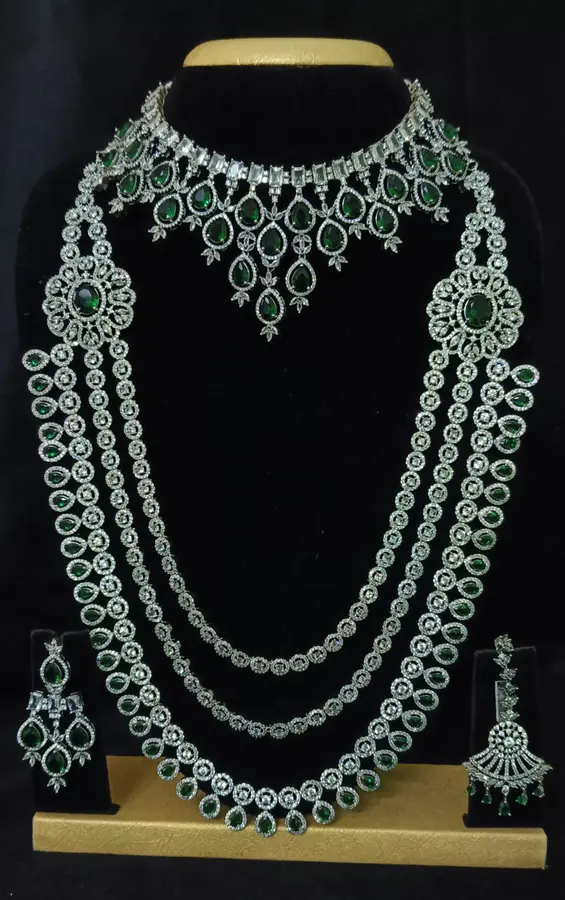 American diamond bridal jewellery set — white stone choker, haram and jhumka on a display stand