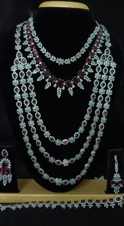 American diamond bridal jewellery set — white stone choker, haram and jhumka on a display stand