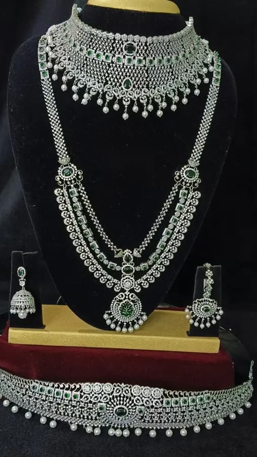 American diamond bridal jewellery set — white stone choker, haram and jhumka on a display stand