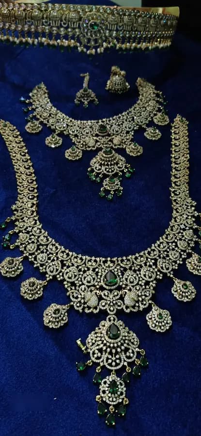 American diamond bridal jewellery set — white stone choker, haram and jhumka on a display stand