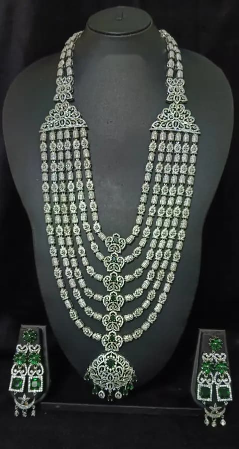 American diamond bridal jewellery set — white stone choker, haram and jhumka on a display stand