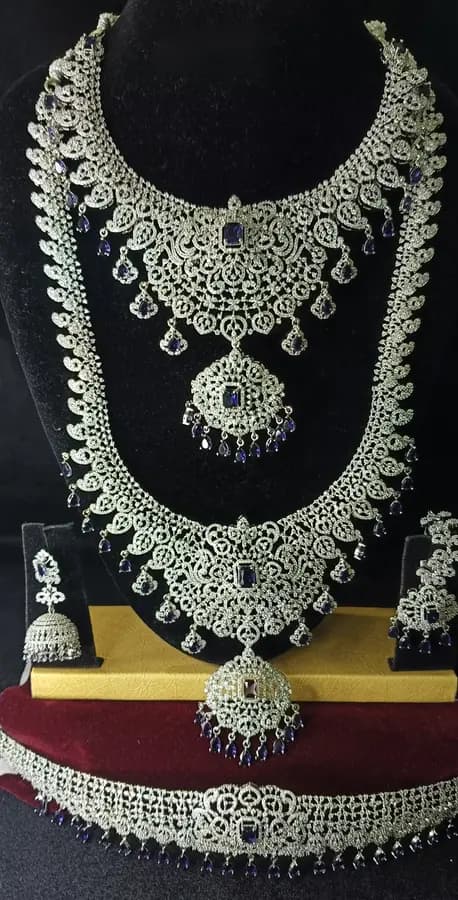 American diamond bridal jewellery set — white stone choker, haram and jhumka on a display stand