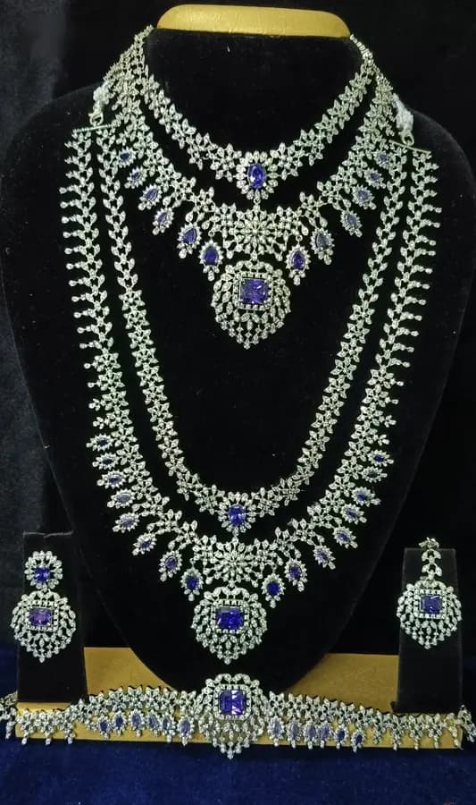 American diamond bridal jewellery set — white stone choker, haram and jhumka on a display stand