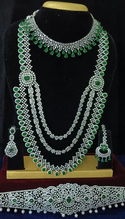 American diamond bridal jewellery set — white stone choker, haram and jhumka on a display stand