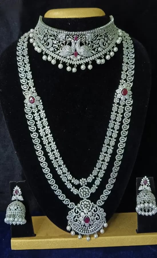 American diamond bridal jewellery set — white stone choker, haram and jhumka on a display stand
