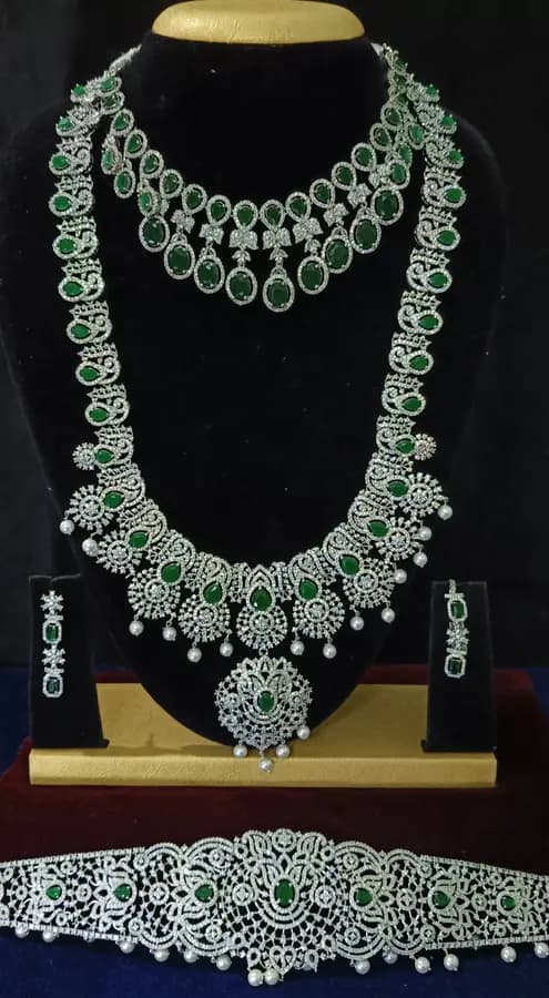 American diamond bridal jewellery set — white stone choker, haram and jhumka on a display stand