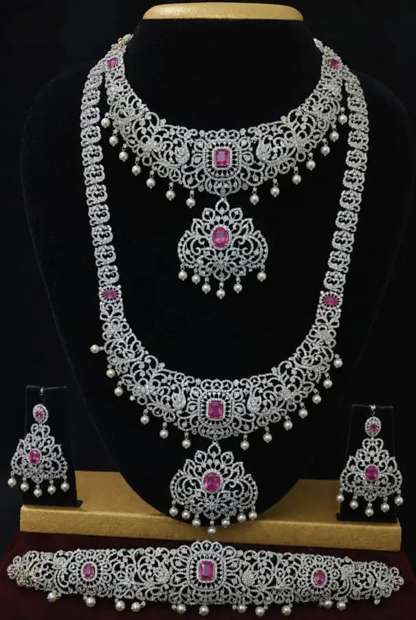 American diamond bridal jewellery set — white stone choker, haram and jhumka on a display stand